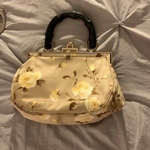 Banana Republic satin handbag. Beige with yellow roses and black wooden handle.
